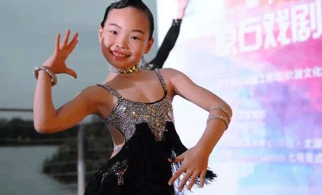 An eight-year-old girl from Wuxi reaped two championships at the Blackpool Dance Festival in England, known as the Olympics of international style of ballroom dancing An eight-year-old girl from Wuxi reaped two championships at the Blackpool Dance Festival in England, known as the Olympics of international style of ballroom dancing