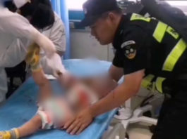 The Nanjinger - Cop Cradles Child Charging to ICU